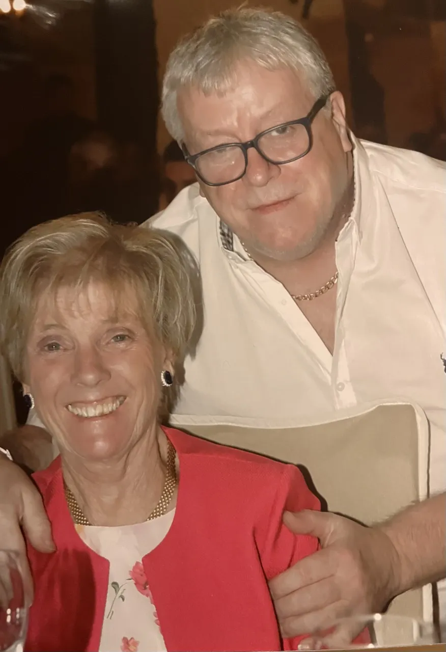Smiling couple at a family celebration