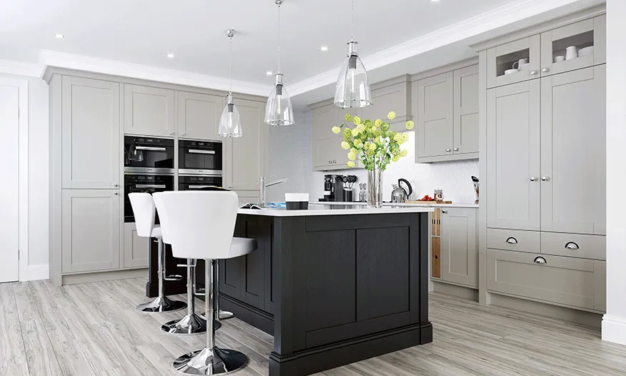 Grey shaker kitchen with black island, integrated double ovens and glass pendants