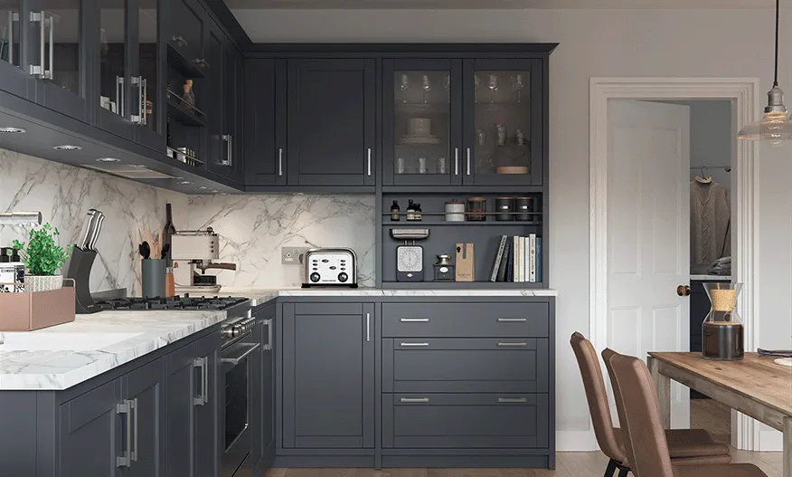 Midnight blue shaker kitchen with marble worktop and glazed wall cabinets