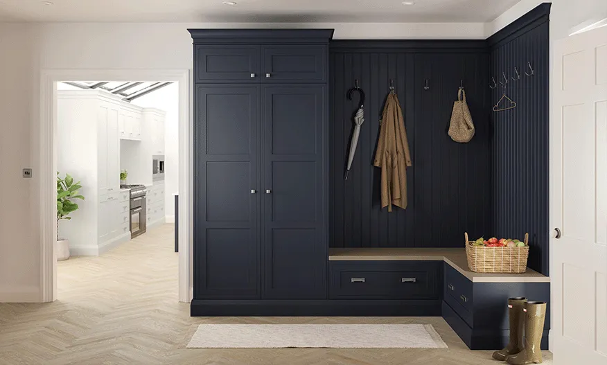 Navy bootroom storage with bench seat, coat hooks and panelled walls