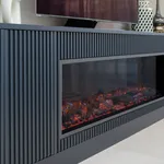 Navy fluted media unit with built-in electric fireplace below the television