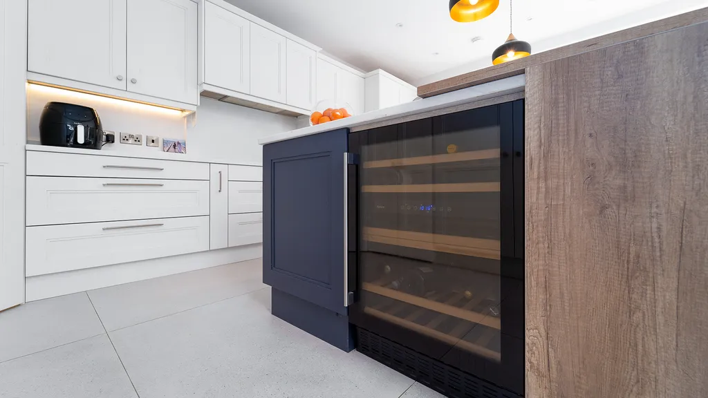 Navy kitchen island end panel with built in wine cooler