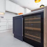 Navy kitchen island end panel with built in wine cooler