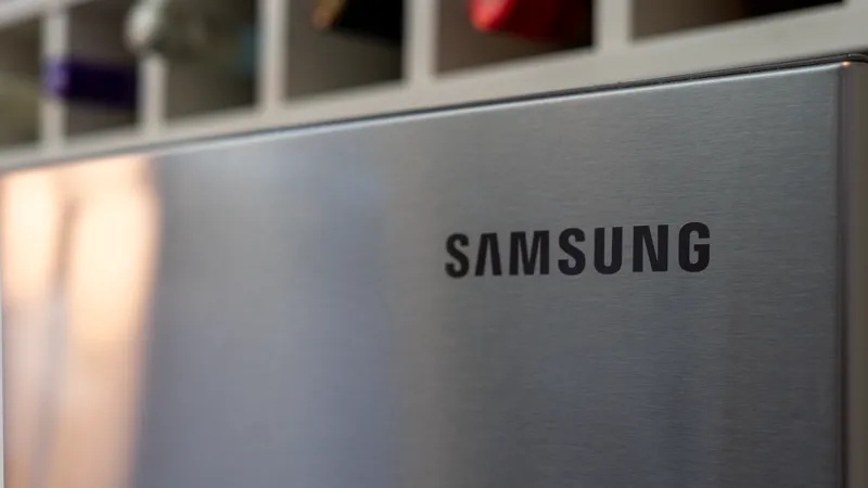 Stainless steel Samsung fridge beneath a built-in wine rack