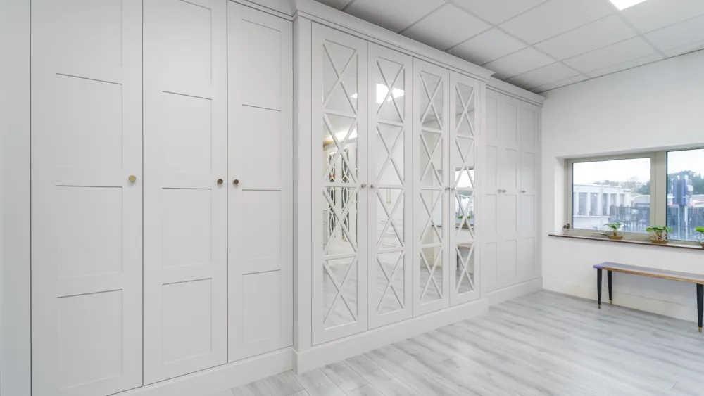 Pale grey shaker wardrobes with mirrored cross panel doors