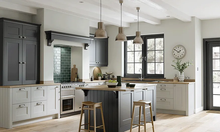 Two tone grey shaker kitchen with green tiled splashback and timber worktops