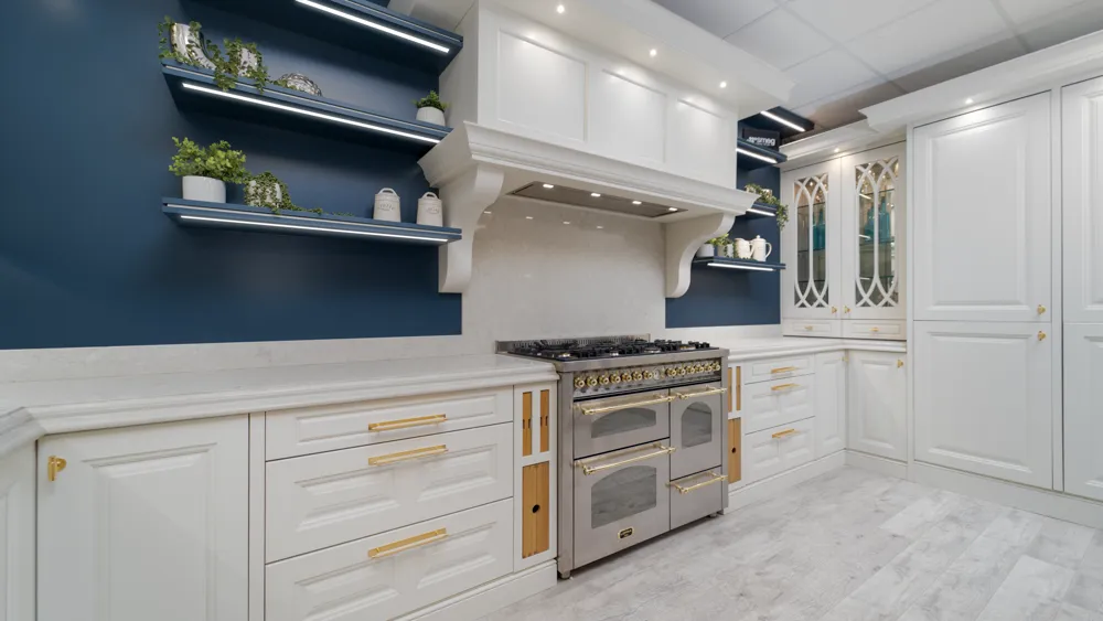 White traditional kitchen with navy feature wall and stainless range cooker