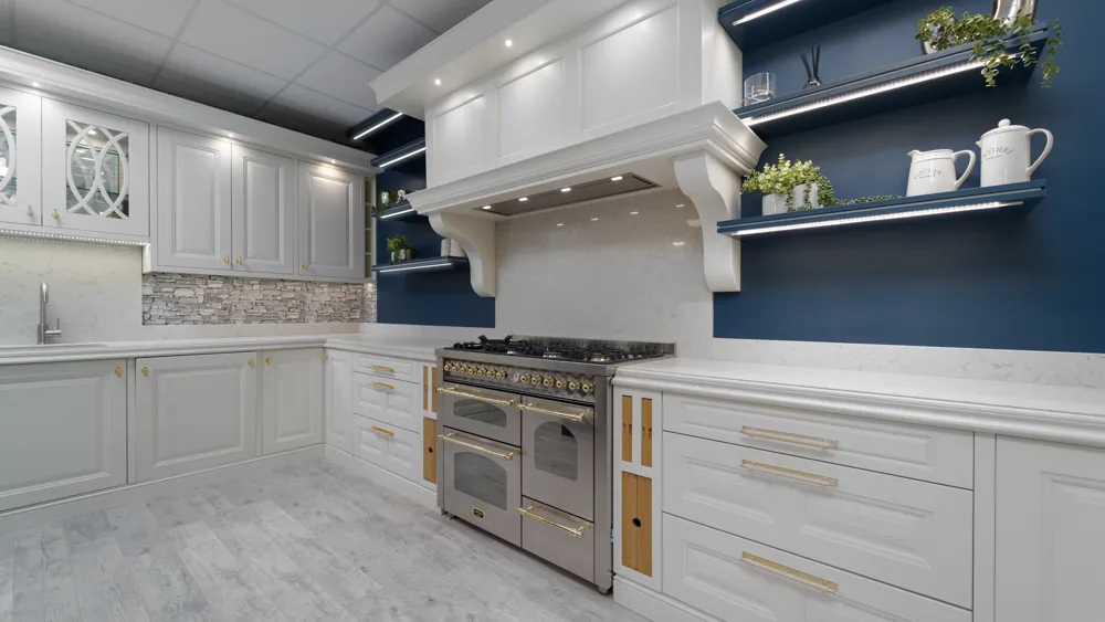 White panelled kitchen corner with stone splashback and range cooker