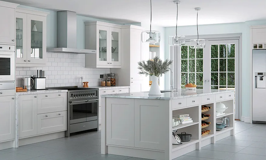 White shaker kitchen with marble topped island, wine rack and range cooker